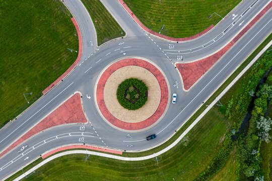 Aerial view of modern roundabout with flowing traffic
