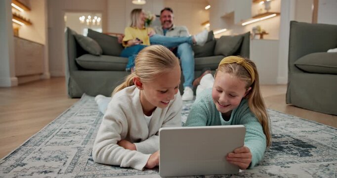 Family home, tablet and children on floor for learning, reading ebook and relax with sister. Tech, happy girls and bonding in lounge for educational app, talking and playing puzzle game with parents
