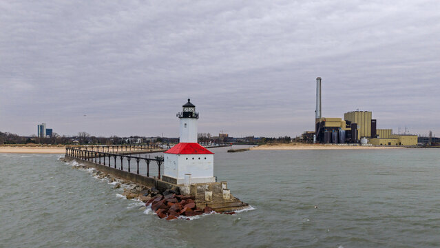 Michigan City Breakwater Lighthouse on Lake Michigan with industry