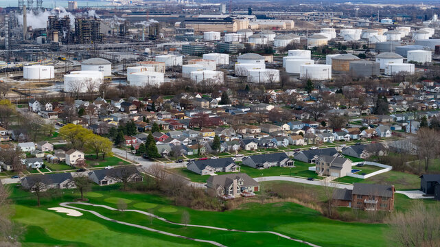 Oil refinery and housing development creating urban sprawl