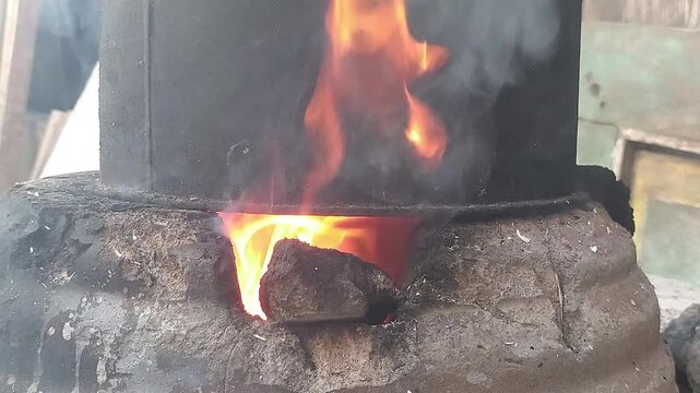 Close Up of Bright Orange Flames in Rustic Wood Burning Stove