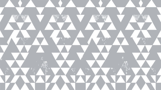 Abstract geometric pattern of white triangles on a gray background with grunge texture