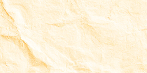 Fototapeta premium Crinkled beige paper texture background with soft folds and creases for design and craft projects