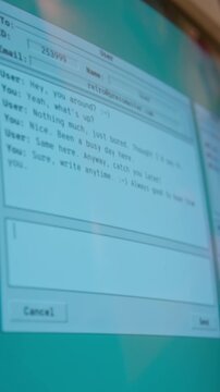 Vertical video of retro computer screen displaying instant messaging application while text is being typed. Ideal for nostalgic technology marketing and history of internet documentaries