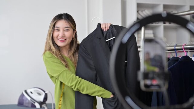 Fashion designer presenting clothes on live stream