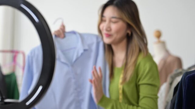 Fashion designer presenting clothes during live stream