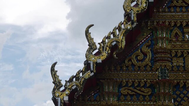 Ornate Thai Temple Roof Ornament Naga Gable Gold Mosaic Glass Detail Buddhist Architecture Decoration Cultural Heritage 