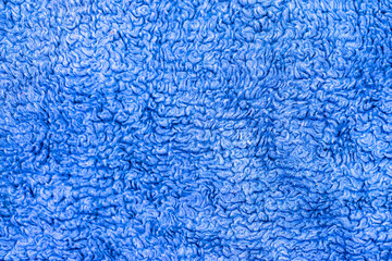 Soft blue terry towel fabric texture close-up background of absorbent cotton textile material structure macro. © Александр Серебрянни