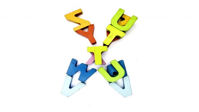 The letter Q was made up with random color wooden letters, stop motion 