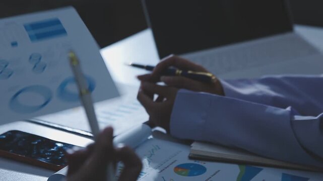 Business accounting concept, Business man using calculator with computer laptop, budget and loan paper in office.