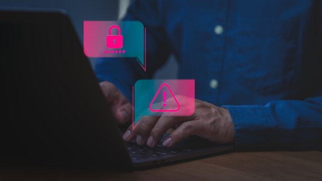 Male user using laptop for cyber attack. Cybersecurity alert with password warning icon. Technology concept for internet security and data protection.