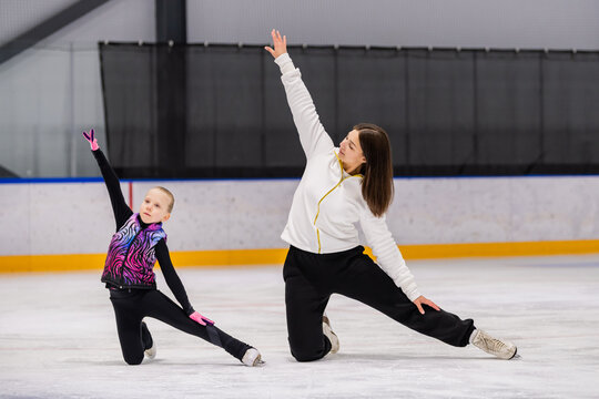 Figure skating coach and student practice routine