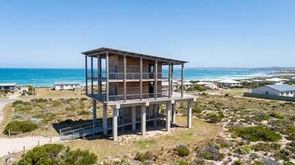 Fototapeta premium Tsunami safe shelter, Elevated coastal architecture, Disaster resilient building, Emergency refuge design, Modern community safety, Blue sky copy space, Infrastructure concept