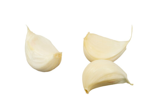 group of three garlic clove or cloves of garlic toes isolated on white or transparent png
