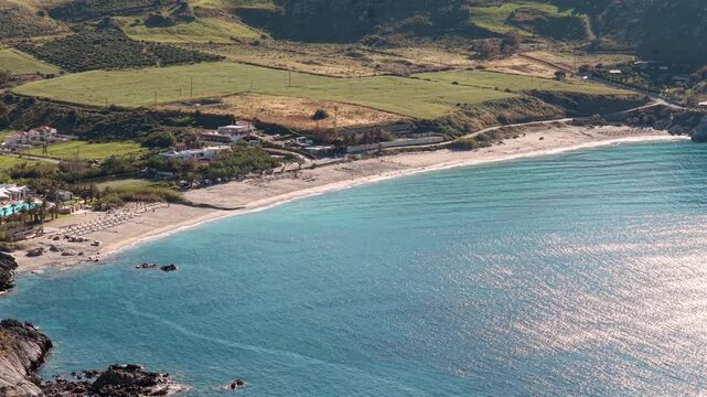 Beautiful beach in the Mediterranean sea on Crete island on a sunny day, drone aerial view

