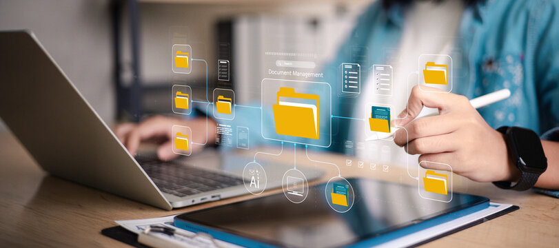 Business person organizing digital files with online document management system on tablet and laptop, data storage folders, smart office.