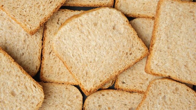 Slow rotation of toasted whole wheat brown bread pieces