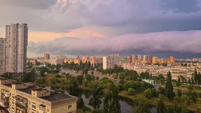 Dramatic Sunset Storm Clouds and Pink Sky Over Kyiv City Skyline, Ukraine
