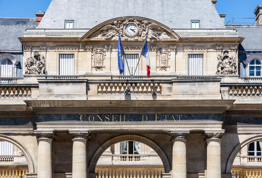 Paris, France - June 17, 2026: Front view of the portico of the Council of State, a public body created in 1799 by Napoleon, decked with french and European Union flags, located in the Palais Royal.
