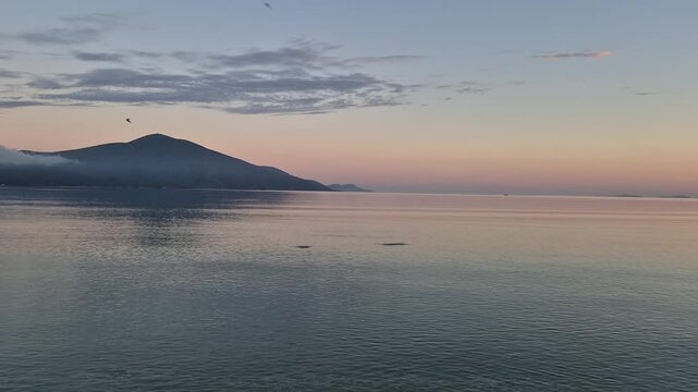 Albania welcomes you to breathtaking Orikum, where the sun rises over calm waters. Experience the serene beauty of the landscape and the soothing sounds of nature.