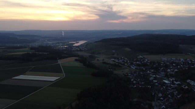 Drone Pan Right Over Tegerfelden Village At Sunset With Aare River In Switzerland