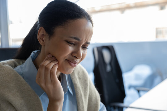 Woman feeling severe tooth pain