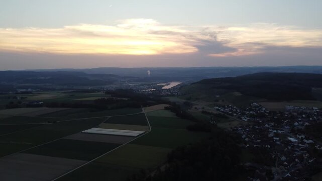 Drone Pan Left Over Tegerfelden At Sunset With Aare River