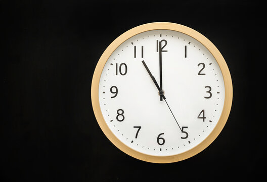 wall clock showing 11 o'clock. 23:00