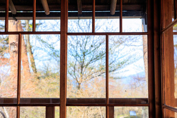 Fototapeta premium Early Spring View Through a Window of Former Hawaiian Kingdom Diplomatic Residence in Ikaho, Japan