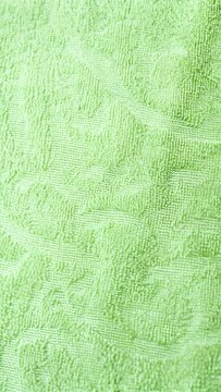 lime green jacquard towel texture with raised floral pattern background