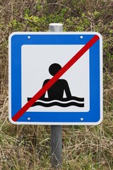 Swimming forbidden road sign