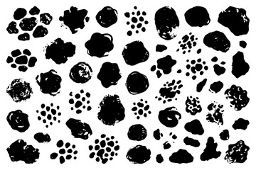 Fototapeta premium Abstract black ink blots and splatter patterns on white background.