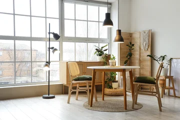 Fototapeten Restaurant Interior of stylish dining room with table, houseplants, big window and glowing lamp  © Pixel-Shot