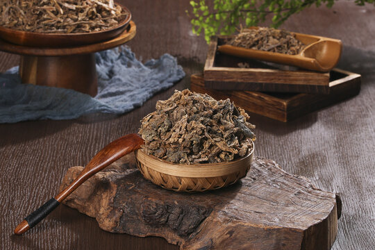 Traditional Chinese Dried Herbs in Wooden Bowls for Cooking and Medicine