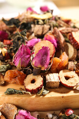 Fototapeta premium Traditional Chinese Herbal Tea Ingredients with Rose Buds and Dried Fruits for Health Enhancement