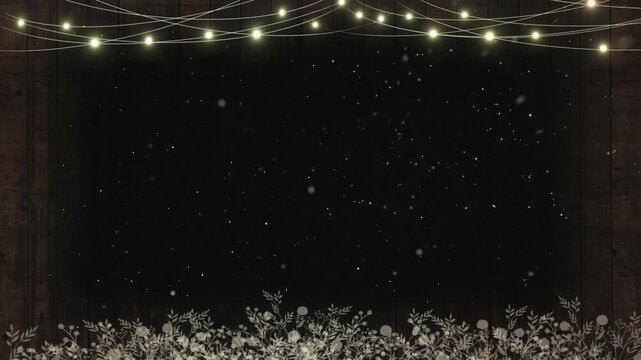 String lights hang above a garden floor covered in white flowers in a dark, atmospheric setting.