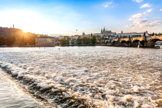Sunset over Vltava river with Charles Bridge and Prague Castle