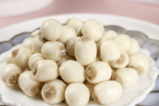 Fresh Lotus Seeds on White Plate - Healthy Asian Superfood Ingredient Studio Shot