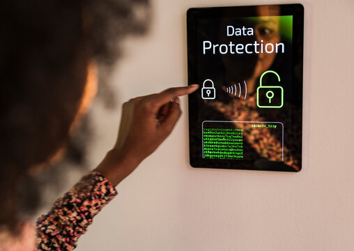 Woman using smart home touchscreen control panel for data protection