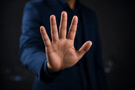 Businessman hand showing palm gestures stop, concept violence, warning, refuse, defense, caution. The hand sign of men a stop. 