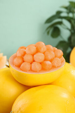 Golden Honeydew Melon Pearls in Yellow Fruit Bowl - Sweet Molecular Gastronomy Spheres with Tropical Background