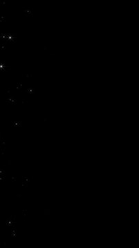 white snow flakes and glitter stars trail page transition alpha channel loop animation, shiny and glitter snow sparks, Christmas and new year holiday vertical social media motion design element