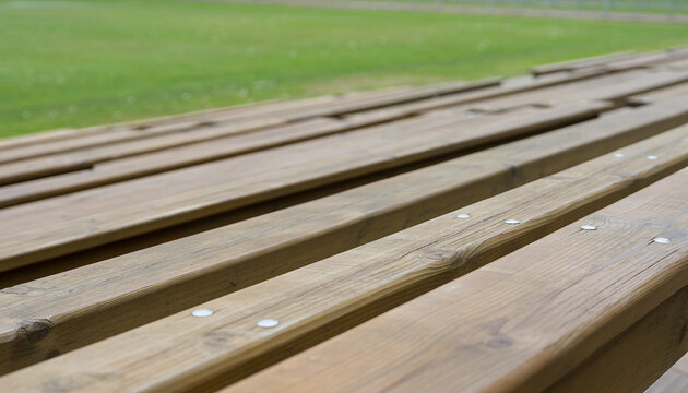 Empty Wooden Bleachers at Sports Field