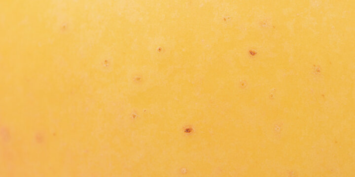 Texture of a yellow apple as a background macro photo.
