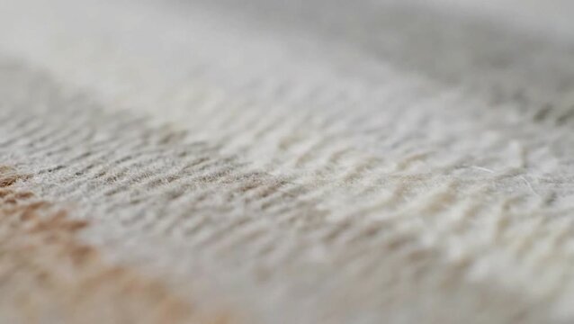 Close-up view of a textured fabric with a woven pattern