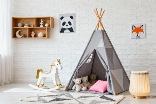 A neatly decorated kids playroom featuring a teepee tent, rocking horse, stuffed toys, and wall art.
