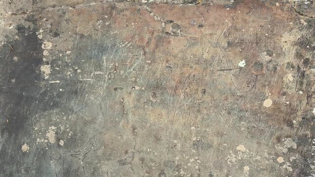 An overhead shot reveals ancient petroglyphs carved into a weathered rock surface at Kalbak Tash in the Altai Republic, Russia