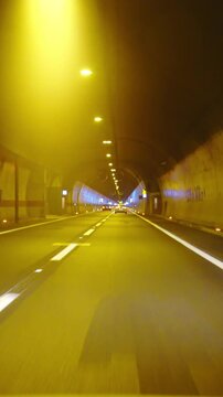 Driving through shiny tunnel