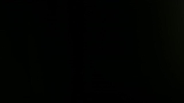 Real Shooted Lens Flare Transitions on Black Background in Slow Motion.