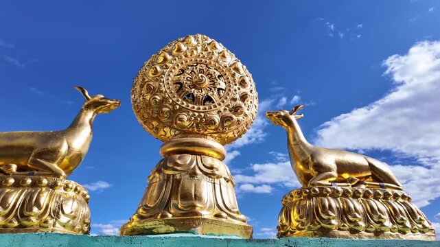 Yunnan, China : Panoramic footage of wheel of Dharma and the 2 deer, a symbol of Tibetan Buddhism in the Sumtseling Monastery in Shangri-La in Yunnan, China under blue sky